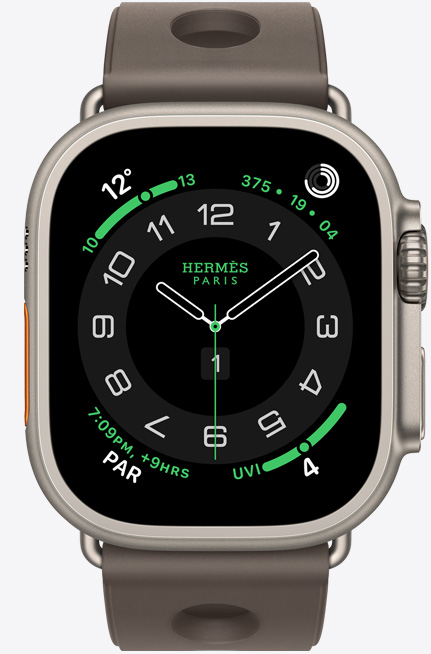 Apple Watch Hermès Ultra 3, titanium case, natural color, Hermès Circulaire watch face, complications: weather, activity rings, Paris time, UV index, right side exterior, Digital Crown, microphone, raised side button, Scub'H Diving band, gris titane color