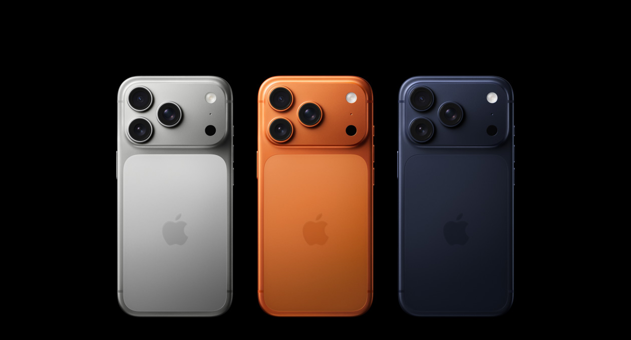 iPhone 17 Pro, back exterior, all three finishes, Silver, Cosmic Orange, Deep Blue, Pro Fusion camera system in top left corner, three lenses, microphone, flash, Apple logo in centre