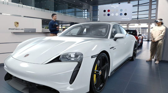 A customer in a Porsche showroom wearing Apple Vision Pro views a 3D projection of a sportscar and talks with an employee
