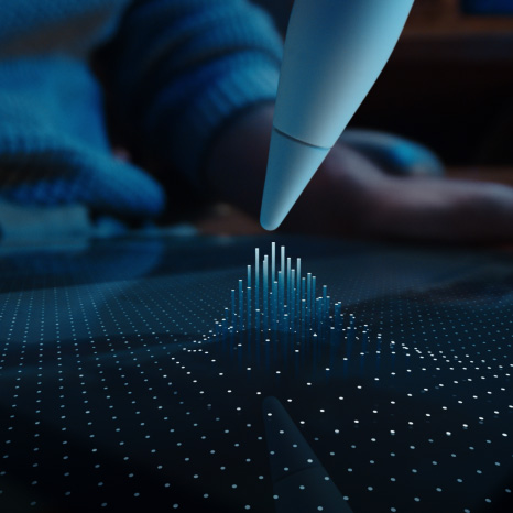 Apple Pencil Pro, white colour, tip of device hovering on iPad display showing a grid of dots with some rising into columns towards the Apple Pencil Pro tip