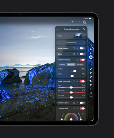 iPad Pro 13″ screen, photo of boulders on beach with blue glows, colour-adjustments tools
